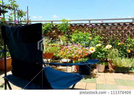 Relax in the flower garden outdoor chair for a luxurious summer time 111378409