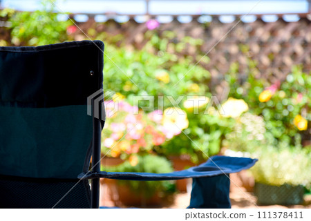 Relax on an outdoor chair - luxurious summer time 111378411