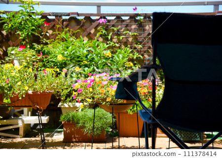 Relax on an outdoor chair on the roof balcony of your condominium for a luxurious summer time 111378414