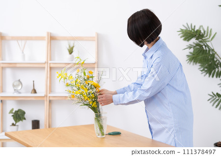 A woman who grows flowers A woman who grows flowers 111378497