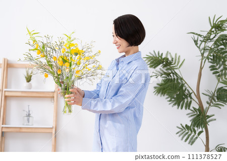 A woman who grows flowers A woman who grows flowers 111378527