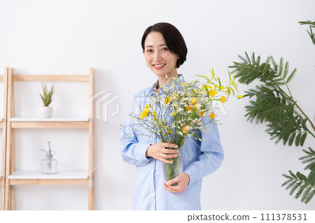 A woman holding a vase A woman holding a vase 111378531