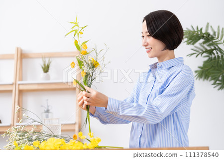 A woman who grows flowers A woman who grows flowers 111378540