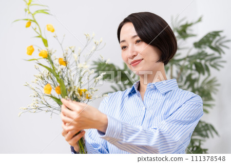 A woman who grows flowers A woman who grows flowers 111378548