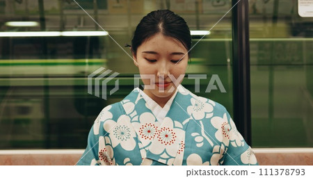 Japanese woman, happy and travel by train in kimono and public transport on metro bullet in city. Person, journey or traditional clothes in fast vehicle on weekend or commute in tokyo on adventure 111378793