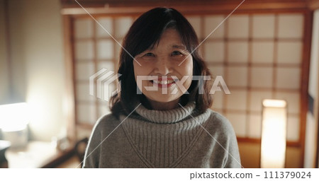 Smile, portrait and mature Japanese woman at her home with positive, good and confident attitude. Happy, proud and face of joyful female person with pride in modern house or apartment in Tokyo Japan. Smile, portrait and mature Japanese woman at her home with positive, good and confident attitude. Happy, proud and face of joyful female person with pride in modern house or apartment in Tokyo Japan. 111379024