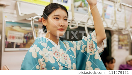 Woman, japan and train, kimono and travel with public transport, metro bullet in city. Person, journey or traditional clothes in motion blur on weekend or commute in tokyo and passenger on adventure 111379121