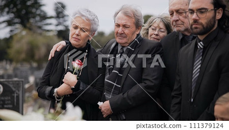 Death, funeral and elderly couple sad together at pain or grief for death and loss during a ceremony. Rose, support or empathy with a senior man and woman feeling depression at a memorial service 111379124