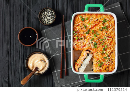 sushi bake with salmon, rice, seaweed, crab meat 111379214