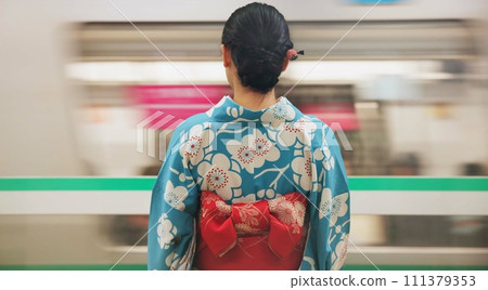Woman, japan and train station, kimono and travel with public transport, metro bullet in city. Person, journey or traditional clothes in motion blur on weekend or commute in tokyo on adventure 111379353