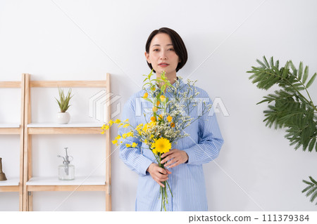 A woman with flowers A woman with flowers 111379384