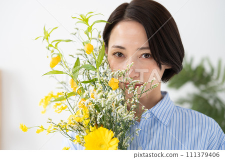 A woman with flowers 111379406