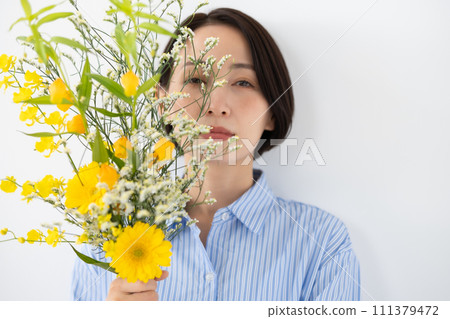 A woman with flowers 111379472