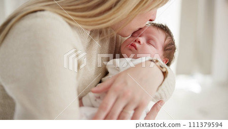 Family, kiss and a mama rocking her baby to sleep in the bedroom of their home together for love or care. Dreaming, nap or tired with a parent and newborn infant in an apartment to rest for growth 111379594