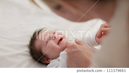 Baby, mother and playing on bed in nursery for bonding, love and support for child development. People, woman and newborn in bedroom of home with fun, hands or happiness for bond, care and smile Baby, mother and playing on bed in nursery for bonding, love and support for child development. People, woman and newborn in bedroom of home with fun, hands or happiness for bond, care and smile 111379661