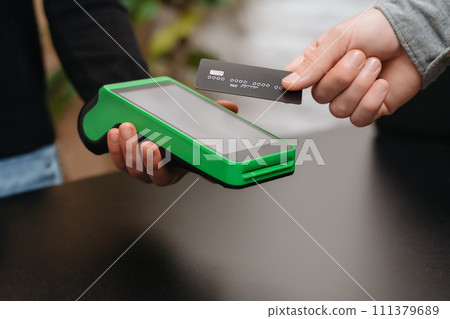 Contactless payment with credit card in store 111379689