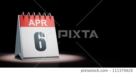 April 6 Calendar Spotlighted on Black Background 111379828