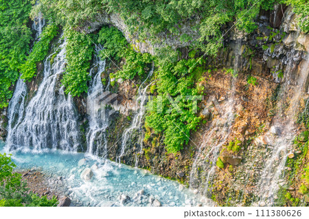 Biei Town, Hokkaido - One of Hokkaido's leading tourist attractions - Shirahige Falls in summer Biei Town, Hokkaido - One of Hokkaido's leading tourist attractions - Shirahige Falls in summer 111380626