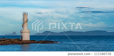 Long Exposure of Ibiza Lighthouse with Es Vedra Island Silhouette Long Exposure of Ibiza Lighthouse with Es Vedra Island Silhouette 111380726