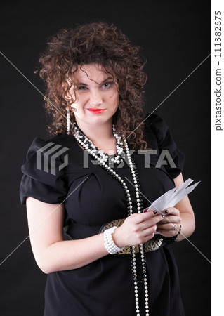 Worried woman calculating her bills 111382875