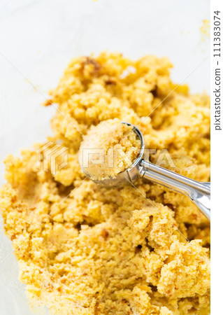 Scooping dough with dough scoop to make cactus cake pops for the Cinco de Mayo celebration. Scooping dough with dough scoop to make cactus cake pops for the Cinco de Mayo celebration. 111383074