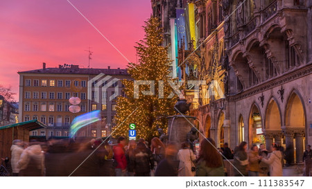 Fish Fountain, Fischbrunnen in front of the New New Town Hall at Marienplatz day to night transition timelapse in Munich, Germany 111383547