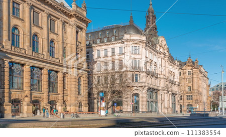 Historical houses on Lenbachplatz square timelapse in Munich, Germany. 111383554