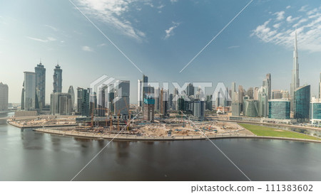 Aerial view to Dubai Business Bay and Downtown with the various skyscrapers and towers timelapse Aerial view to Dubai Business Bay and Downtown with the various skyscrapers and towers timelapse 111383602