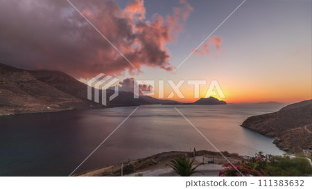 Panorama showing sunset on Amorgos island aerial timelapse from above. Greece Panorama showing sunset on Amorgos island aerial timelapse from above. Greece 111383632