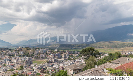 Panorama showing Gjirokastra city from the viewpoint with many typical hystoric houses of Gjirokaster timelapse. 111383645