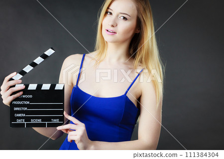 Woman holding professional film slate 111384304