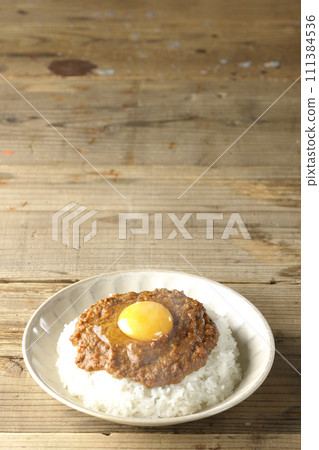 Spicy hot keema curry topped with egg yolk Spicy hot keema curry topped with egg yolk 111384536