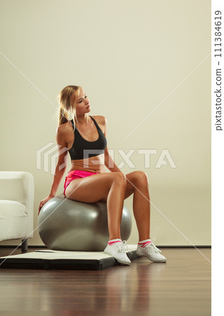 woman doing fitness exercises with fit ball woman doing fitness exercises with fit ball 111384619