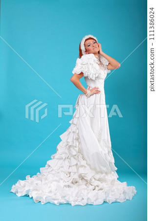 Beautiful ginger in a dress of Snow Queen 111386024