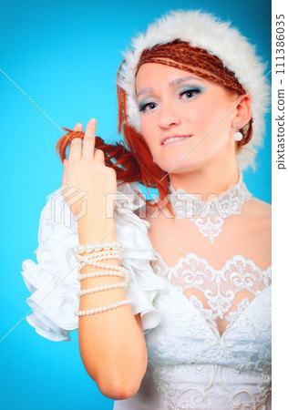 Beautiful ginger in a dress of Snow Queen 111386035