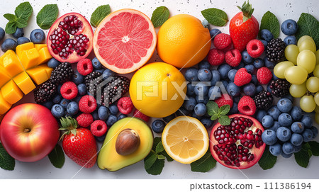 Horizontal background of bright fruits. Ripe fruits apples, bananas, grapes, kiwi, avocado, raspberry on a stone background. Copy space. 111386194