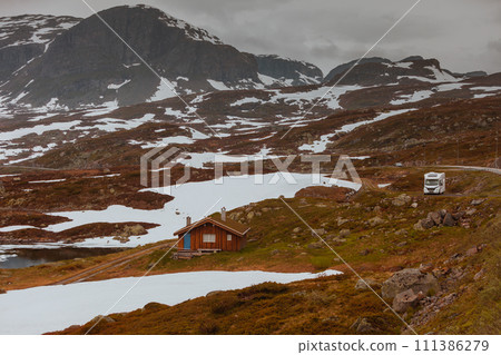 Camper car in norwegian mountains 111386279