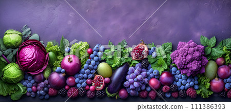Purple composition. Background bright fruits and vegetables apples, grapes, greens, blueberries, eggplant, figs, cabbage, pomegranate, blackberry on purple background. Copy space. 111386393
