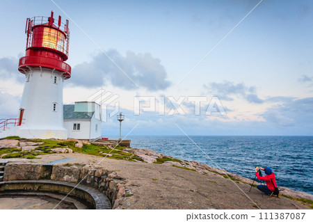 Tourist at Lindesnes Lighthouse in Norway 111387087