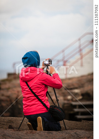 Tourist at Lindesnes Lighthouse in Norway 111387092