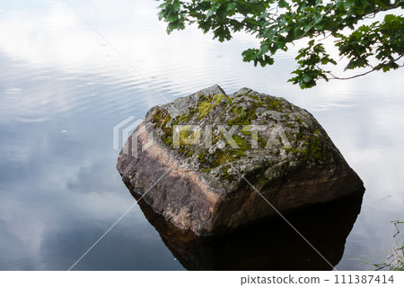 Big stone in water river Big stone in water river 111387414