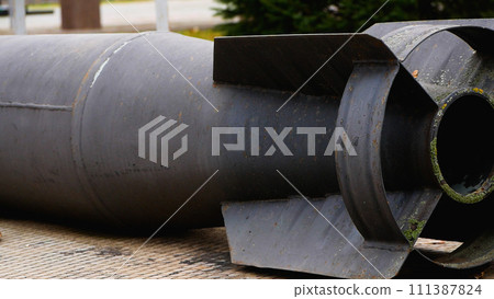 Tail section from ammunition, missile. Panorama. A real war. 111387824