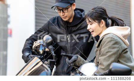 Men and women who enjoy motorcycles 111388208