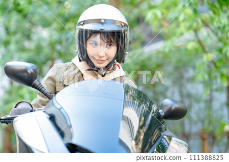 female rider riding a bike 111388825