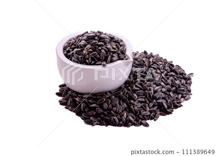 dried grains bird food. Black sunflower seeds in pot. 111389649