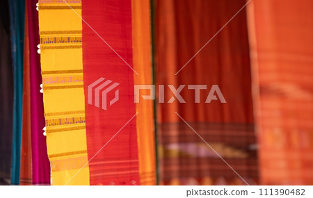 Colorful Tai Lue woven fabric from northern of Thailand. (Selective focus). Colorful Tai Lue woven fabric from northern of Thailand. (Selective focus). 111390482