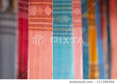 Colorful Tai Lue woven fabric from northern of Thailand. (Selective focus). 111390488