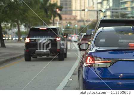 Cars traffic driving on American street with traffic lights in Miami, Florida. USA transportation Cars traffic driving on American street with traffic lights in Miami, Florida. USA transportation 111390693