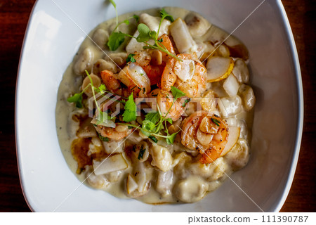 gnocchi with shrimp and pear gnocchi with shrimp and pear 111390787