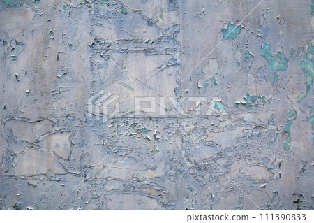 Old cracked abstract grunge vintage texture copy space background, retro pattern. White irregular spots paint peeling of light blue concrete or wooden wall or ceiling flat surface. 111390833